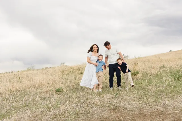 Bonnie Dismore outdoors in Colorado with her husband and two sons